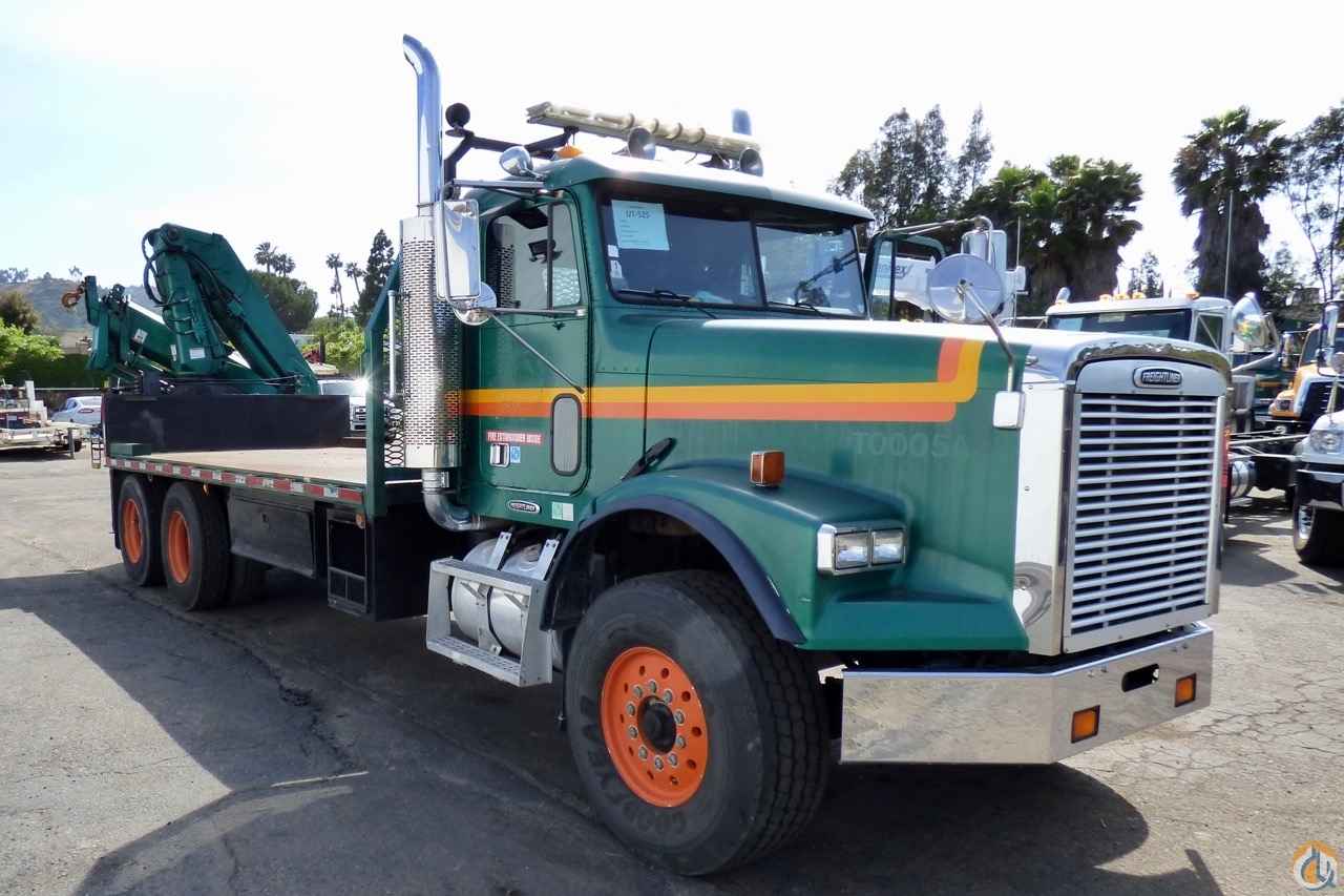 Hiab 300-3 articulating crane mounted to Freightliner FLD 120S chassis